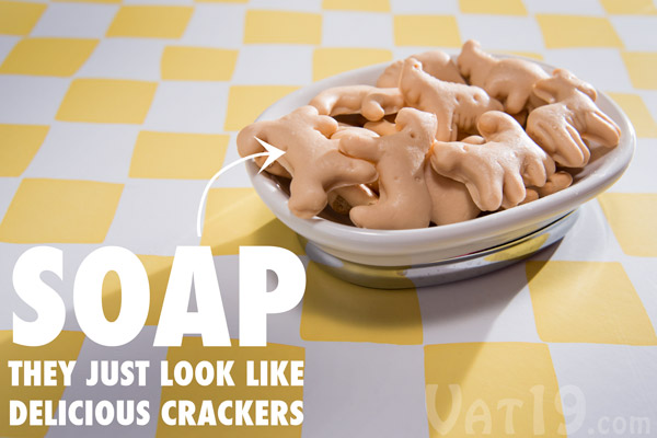 Animal Cracker Soaps in a soap dish on a table.