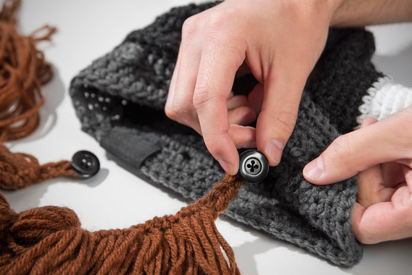 The beard attaches to the hat via two buttons.