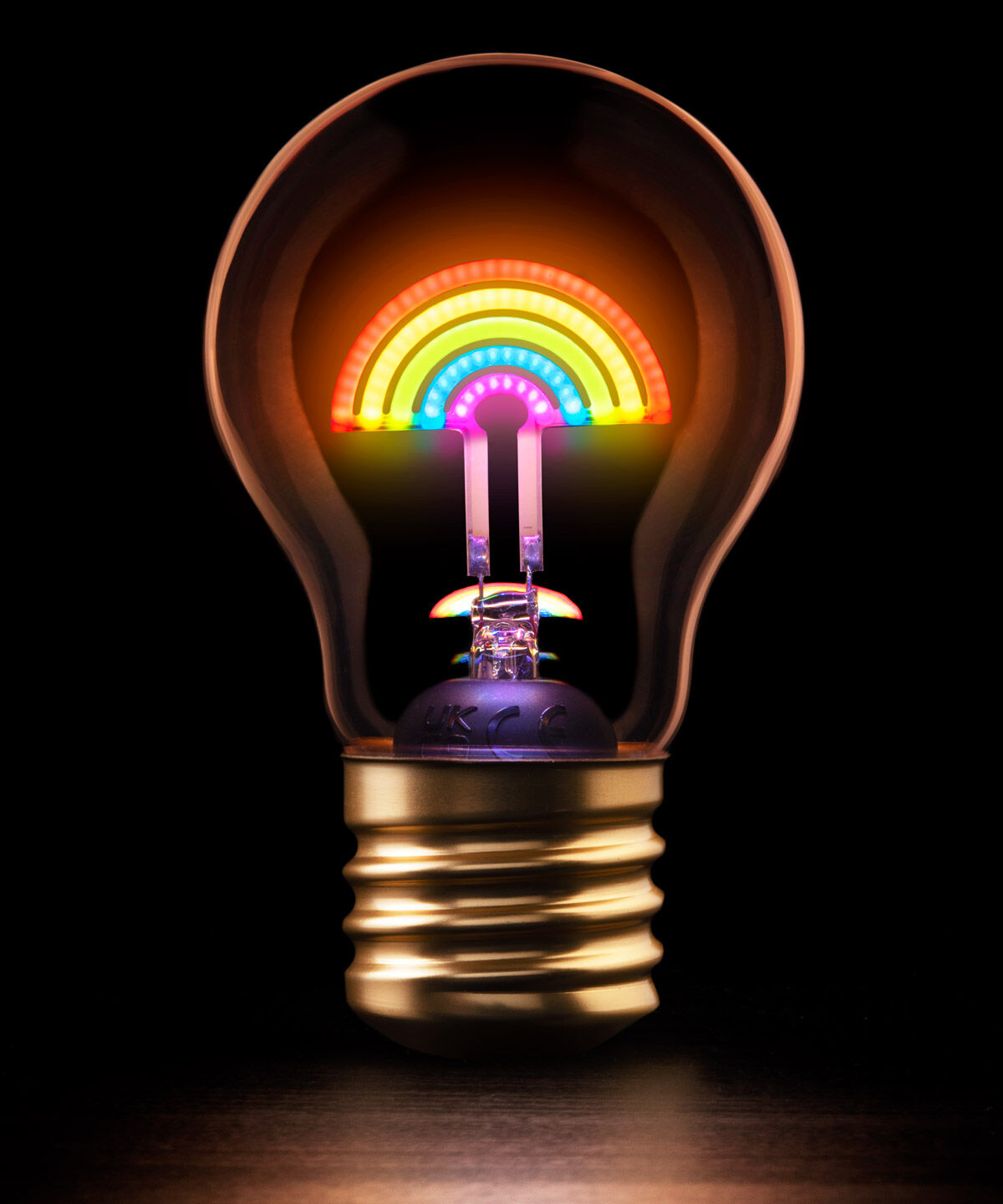 Rainbow Lightbulb Light A rechargeable tabletop lightbulb with rainbow