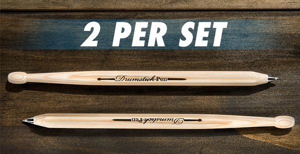 A set of Drumstick Pens lays horizontally on a table.