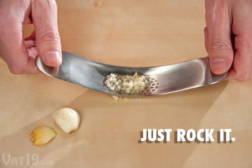 Rock the Garlic Rocker back and forth over the garlic to crush it.