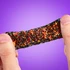 Stretch it, squeeze it, splat it, and watch the sparkles transform from green to orange as it moves through light.