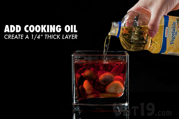 Pour in vegetable cooking oil to create a quarter-inch layer.